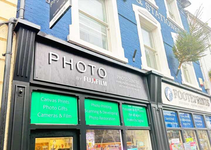 Enhancing Footeprints' Storefront with a Fujifilm Photo Shop Fascia Sign and Custom Window Graphics