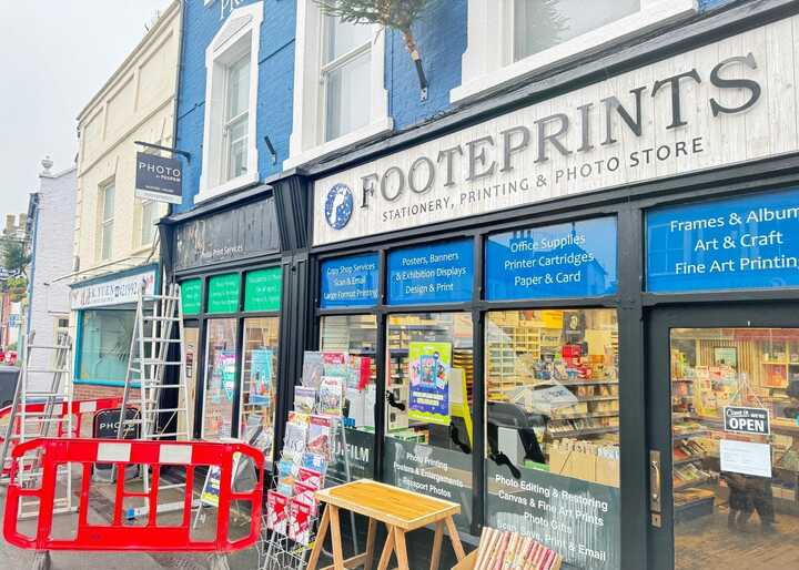 Enhancing Footeprints' Storefront with a Fujifilm Photo Shop Fascia Sign and Custom Window Graphics