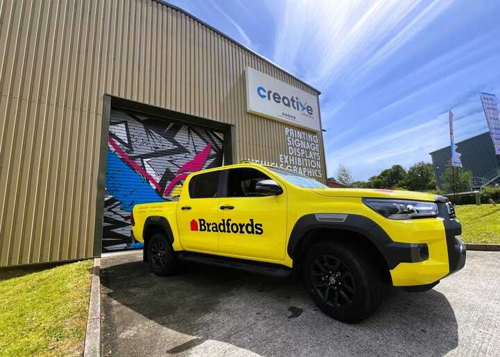 A Side-By-Side Before and After! Bradfords newly branded Toyota Hilux's