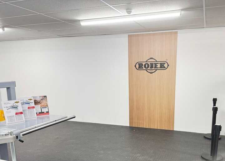 Cut Vinyl Rojek Logo Wall Graphic Applied To Plywood Panel