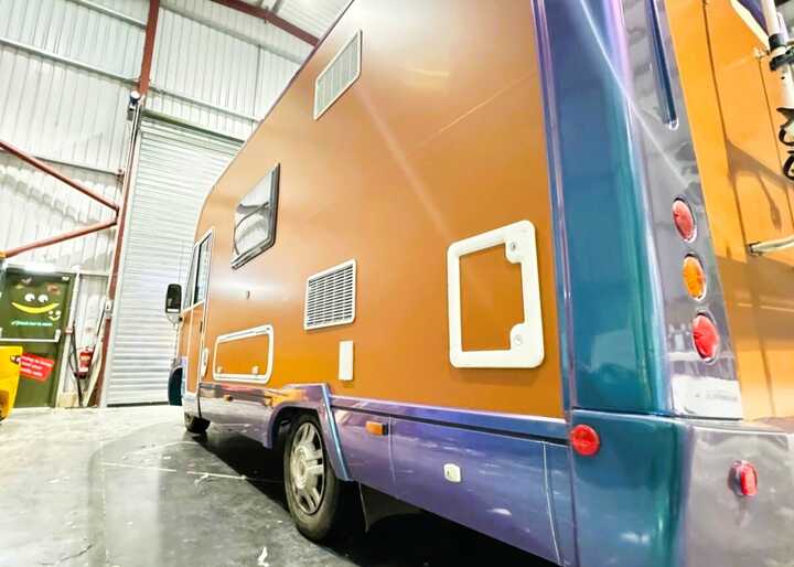 Member of staff expertly cutting vinyl in our cutting-edge vehicle graphic facility