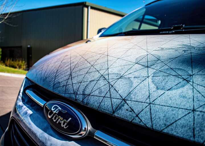 Close up of nautical compass in sunset colours on VW Transporter bonnet - created and printed by Creative Solutions