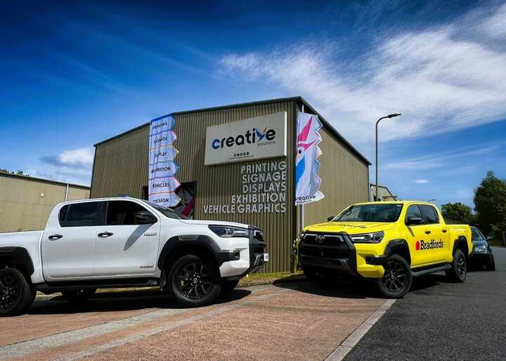 A Side-By-Side Before and After! Bradfords newly branded Toyota Hilux's