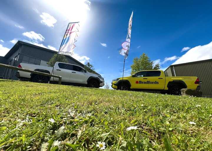 A Side-By-Side Before and After! Bradfords newly branded Toyota Hilux's