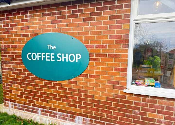 New Wall Mounted ACM Oval Panel Sign at Dalwood Community Shop