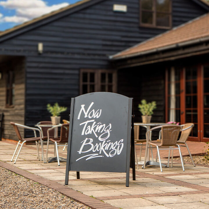 Premier A-Board outside holiday lodge showing bookings artwork.jpg