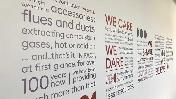 Mission Statement and Company Core Values printed onto vinyl mounted on wall in conference room