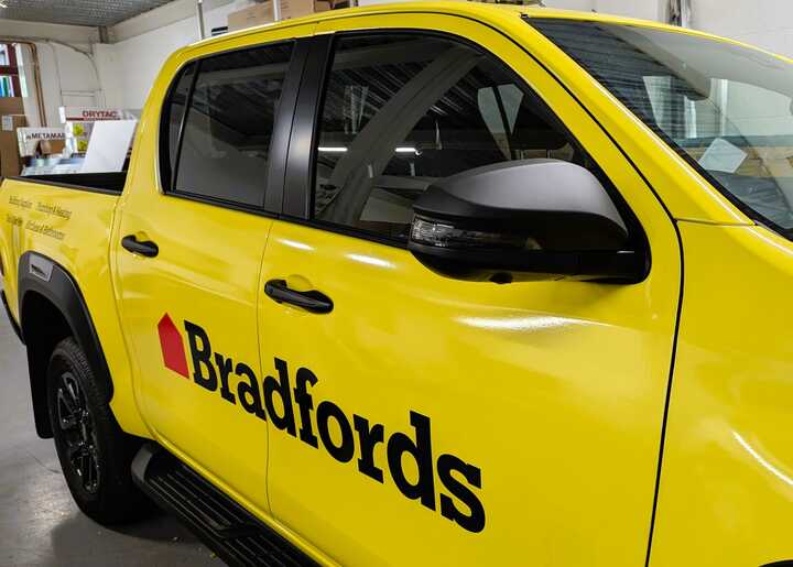 Drivers Side Close-Up Wrap & Branding - Toyota Hilux Invincible X for Bradfords Building Supplies