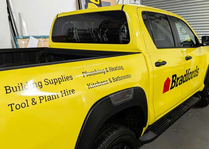 Cut-Vinyl Graphics Application Close-Up Wrap & Branding - Toyota Hilux Invincible X for Bradfords Building Supplies