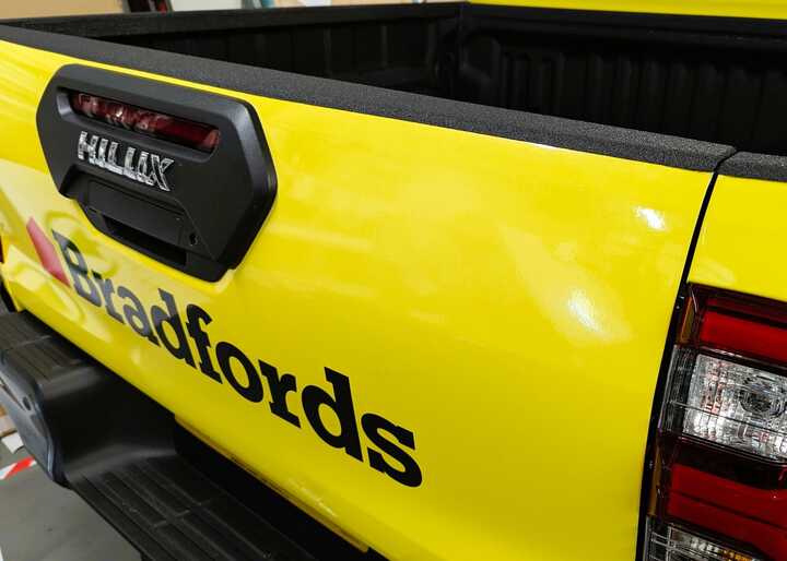 Rear Close-Up Wrap & Branding - Toyota Hilux Invincible X for Bradfords Building Supplies