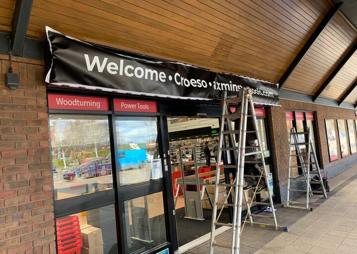 Illuminated Flex Face Signage - Banner being installed into tray.jpg